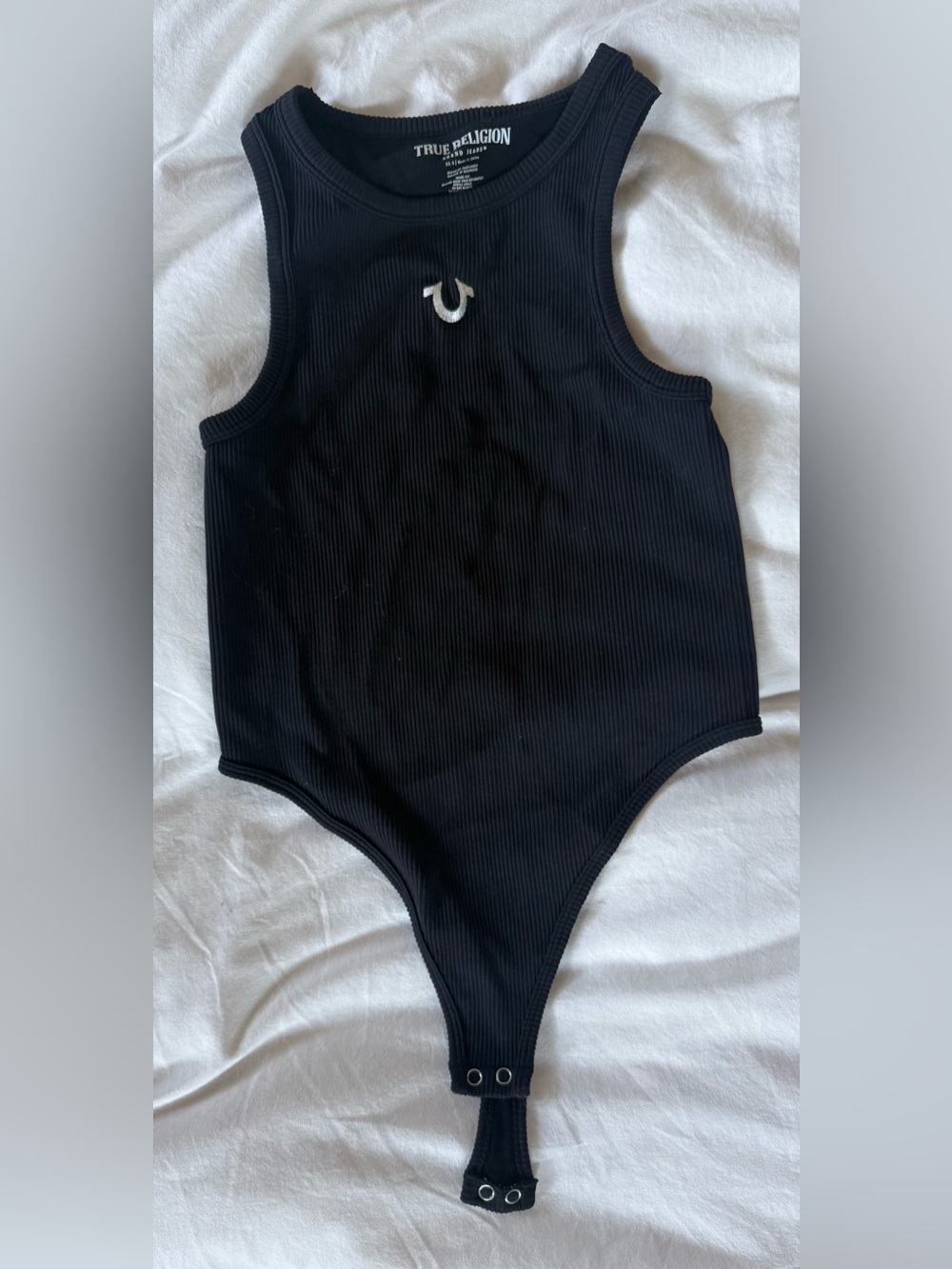 Never worn. True Religion Women’s Black Ribbed Bodysuit